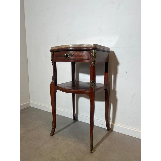 Elegant antique French Louis XV style side table with a beautifully shaped pink and green marble top, one drawer, and a...