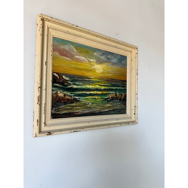 Immerse yourself in the golden glow of this vintage 1970s oil painting by Fran S., capturing a stunning sunset over the...