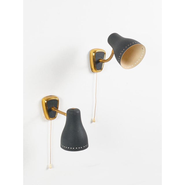 Jacques biny (1913-1976) pair of wall sconces france, circa 1950 brass and lacquered metal h: 13 cm / w: 21 cm jacques...