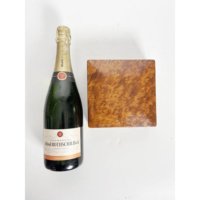 Elegant square wooden box dating from the 1970s, France. The exterior is distinguished by a richly figured burl wood...