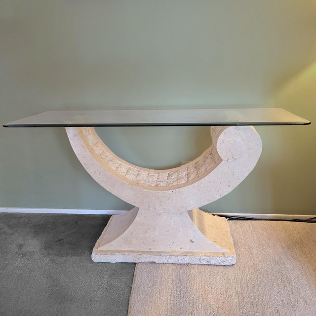 Postmodern sculptural natural mactan stone console table. Circa 1980s. Sculptural postmodern pedestal with a contrasting...