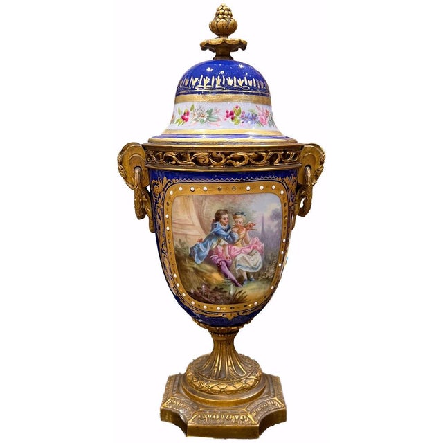 excellent pair of vase, of french origin, made of mercury-gilt bronze and porcelain marked "sevres" This piece has an...