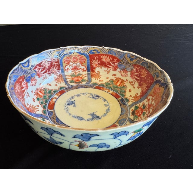 A finely painted Japanese Imari porcelain bowl dating to the Edo period, 18th century. This example features a gently...