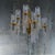 This glamorous Sciolari chandelier has 10 brass arms that reach out from its center column. 110 long glass rods encircle...