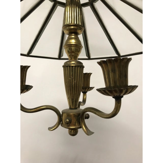 This chandelier in glass and bronze is from around 1920-1930. European Plug (up to 250V).The wiring of this item may be...