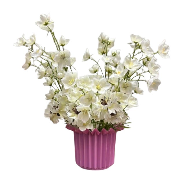 This vintage pleated planter by Kosma showcases a bold geometric design characteristic of late 20th-century West German...