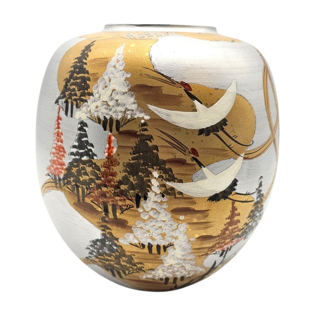 A refined example of late 20th-century Kutani ware, this hand-painted Japanese porcelain vase presents a lyrical crane...