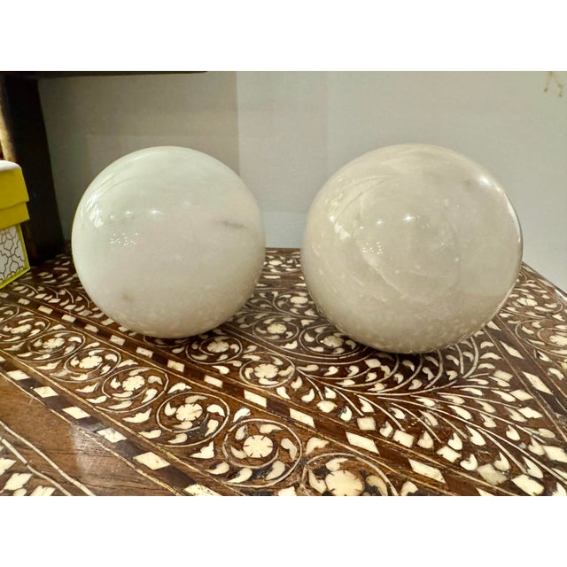 Pair of handmade Italian made white marble decorative spheres, can be used as bookends.
