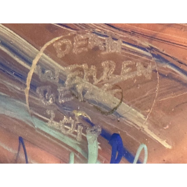 This Glass Asylum hand-blown art glass vase features a beautiful pink and blue swirl pattern, adding a touch of elegance...