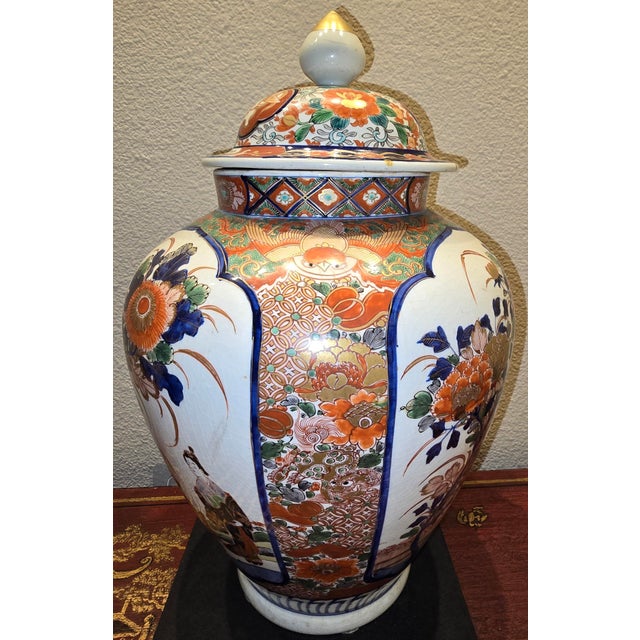 Japanese Verte Imari Covered Jar Circa 19th Century with Flowers, Dragons, and Figures of Woman and Child