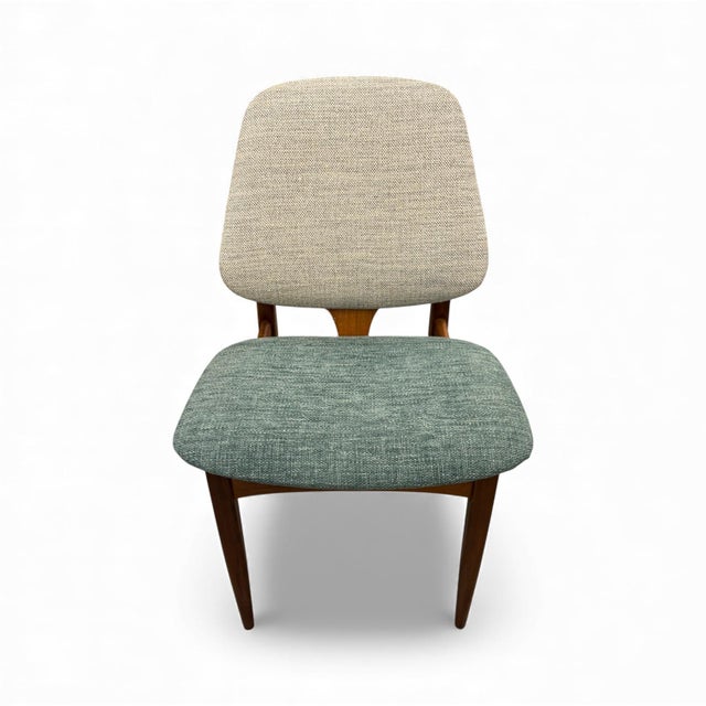 Set of four Mid-Century chairs made of teak. A British design from the 1960s by Elliots of Newbury, featuring high-quality...