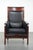 Black cowhide leather Schuitema Art Deco design armchair with a high back and beautiful woodwork from the Decoforma...