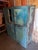 Beautiful statement piece. Bright and faded chippy wood in different shades of blue. Four doors and lots of cabinet space....