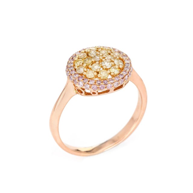 Stylish pink & yellow diamond ring crafted in 18 karat rose gold. 17 yellow diamonds total an estimated 0.60 carats,...