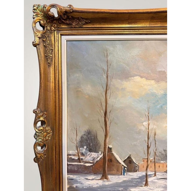 Housed within an impressive and ornate gilt wood frame, this captivating large-scale oil painting captures a serene and...