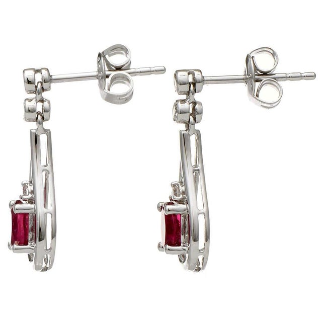 Tourmaline glistens in the center of these white gold teardrops that glitter with precisely placed diamonds. The bright...