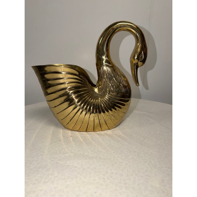 Brass swan is a perfect table decoration or planter. Graceful neck, beak pointed down,. feature details embossed in brass,...