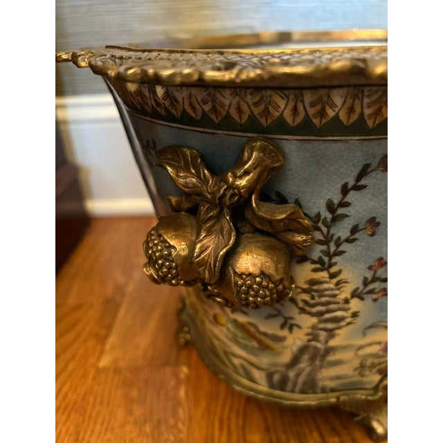 A lovely 20th Century Chinoiserie cachepot by Danny's Fine Porcelain. Features a lobed porcelain body in blue with bird...