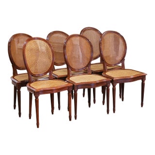 Mid 20th Century Mid-Century French Louis XVI Carved Walnut and Cane Dining Chairs, Set of Six For Sale