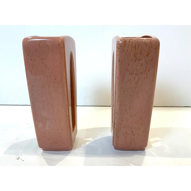 1950s pair of Howard Pierce Pink Glaze Vases With white Giraffe and Palm Tree in the middle. Signed at the bottom.