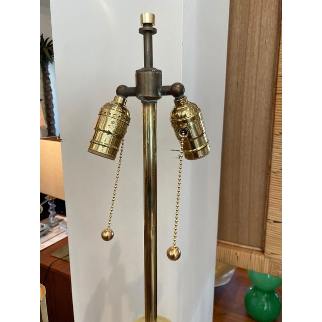 Brass tubular column lamp on slate bases, newly rewired with silk covered wire.