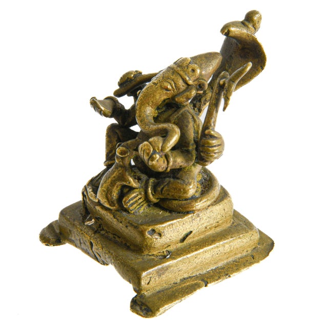 Rich in symbolism and devotional significance, this antique brass figure depicts Lord Ganesha, one of Hinduism's most...