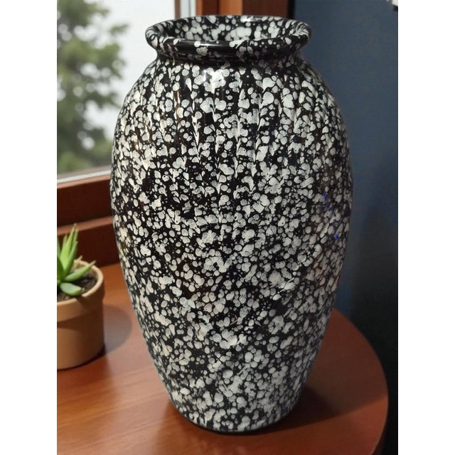 This vintage Art Deco style speckled ceramic vase features a classic black and white color scheme, perfect for all...