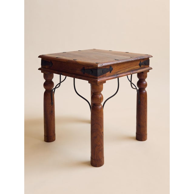 This vintage side table set features a sturdy iron base paired with warm, solid wood tops. The clean, architectural lines...