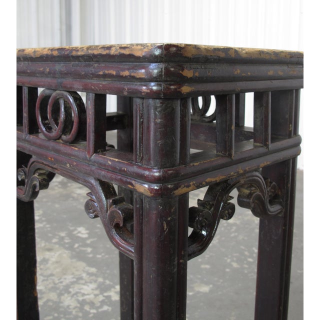 This 19th century pedestal table features a tall, slender silhouette constructed from solid elm with tenon and mortise...