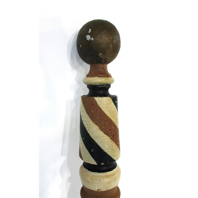 A smaller sized Folk Art barber pole which hung outside on a porch post or end cap of a building. Probably from the late...