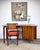 A unique and sculptural mid century modern writing desk with trapezoidal top shape and tambour door, circa 1960’s....