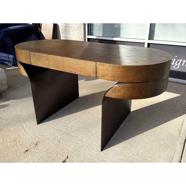 Still offered by Restoration Hardware today starting at $5,580 and marked by its sculptural presence and rich material...