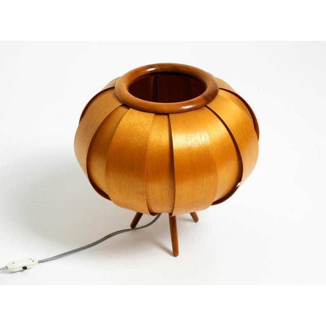 1960s wood veneer tripod lamp on wooden legs. the entire shade is made of oiled birch veneer. designed by the well-known...