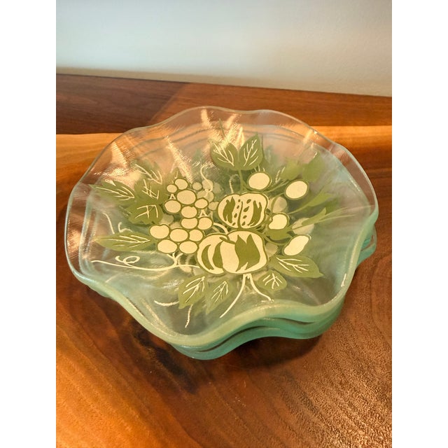 A charming set of four vintage clear glass berry or dessert bowls in an Organic Modern style, featuring beautifully...