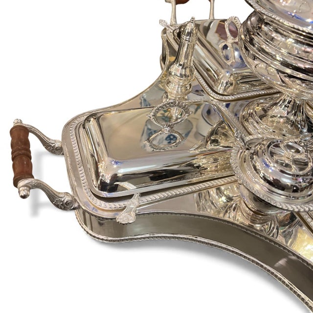 This Victorian alpaca silver serving set, with its rotating Lazy Susan, is a work of art from late 19th-century English...