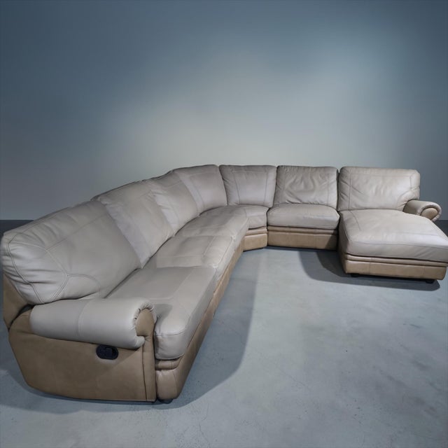 A beautifully restored large-scale curved leather sectional designed for both comfort and presence. This 6-piece modular...