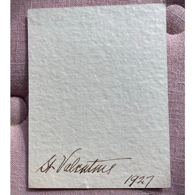 This is a charming 1927 paper Valentine. Inscribed on the front is “Who is it sends this Valentine with lots of love in...