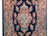 A wonderful early 20th century Persian Sarouk rug with a central floral medallion surrounded by a border woven with...
