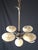 Vintage 1950s chandelier in chrome-plated metal, with five arms illuminated by five pale yellow opaline glass shades (four...