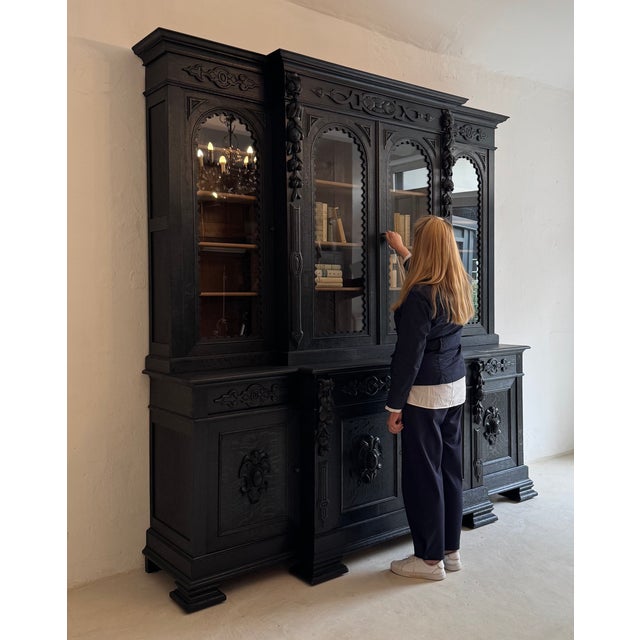 Large bookcase or display cabinet dating from around 1900. Crafted from solid oak. Good refurbished condition with...