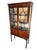 Edwardian Mahogany Cabinet with Inlaid panel at cresting over 2 glassed doors revealing 2 shelves, over 2 panels...