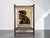 Really unique vintage fiber art piece with a stylized animal design woven in black and warm golden brown against a soft...