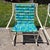 This is a retro aluminum rocking chair by Samsonite, circa 1960s. The chair features a white powder coated aluminum frame...