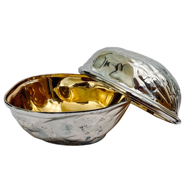 A whimsical vintage walnut-shaped nut box made for F.B. Rogers Silver Company featuring a highly detailed, textured...