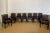 We are very pleased to offer a regal set of eight dining chairs, circa the 1980s. The chairs' square back design showcases...