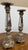 Design Plus Gallery presents a Pair of Mirrored Column Candleholders. Each candleholder has a tapered, faceted stem inset...