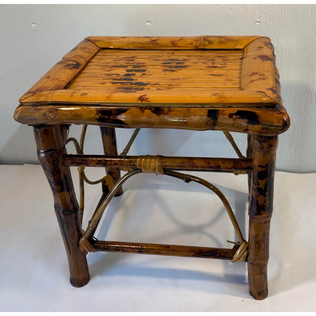 Love this burnt bamboo plant stand or small side table