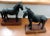Pair Chinese patinated bronze models of horses on fitted hardwood display stands. Heavy weight. Each measures 7 1/2" x 7...