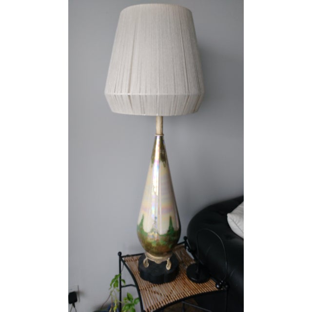 A beautiful Mid-Century table lamp in gold, green, and pearl tones. You can stare and discover many things in the...