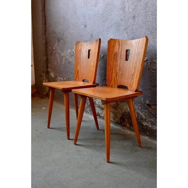 This pair of chairs, with an uncompromising design, is made entirely of wood. Brutalist design with rustic inspiration, we...